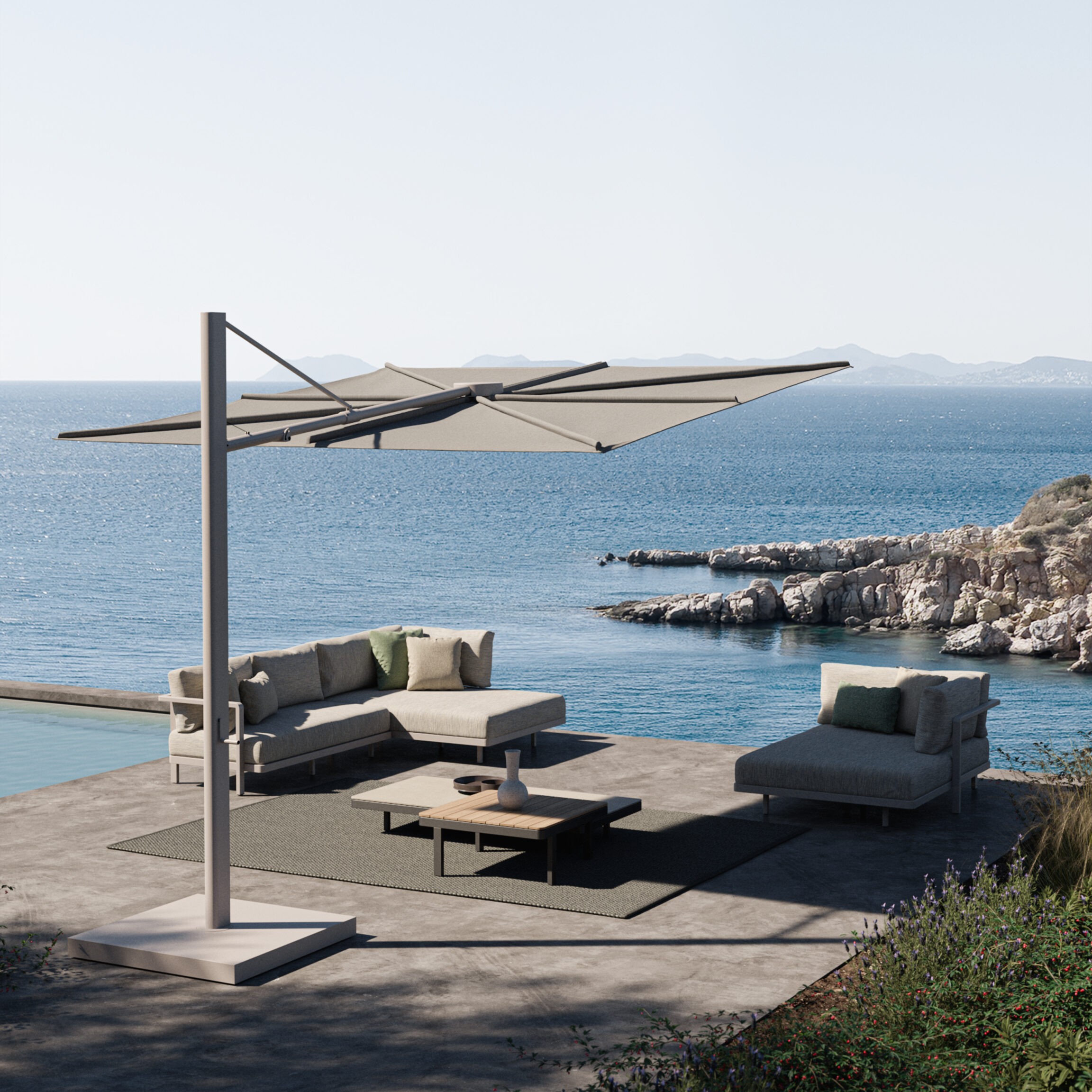 Image of Royal Botania Solaz parasol and Alura Lounge furniture with sea in the background