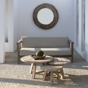 Image of grouped 3 Anton circular low teak tables in front of Copenhague teak sofa by Gommaire