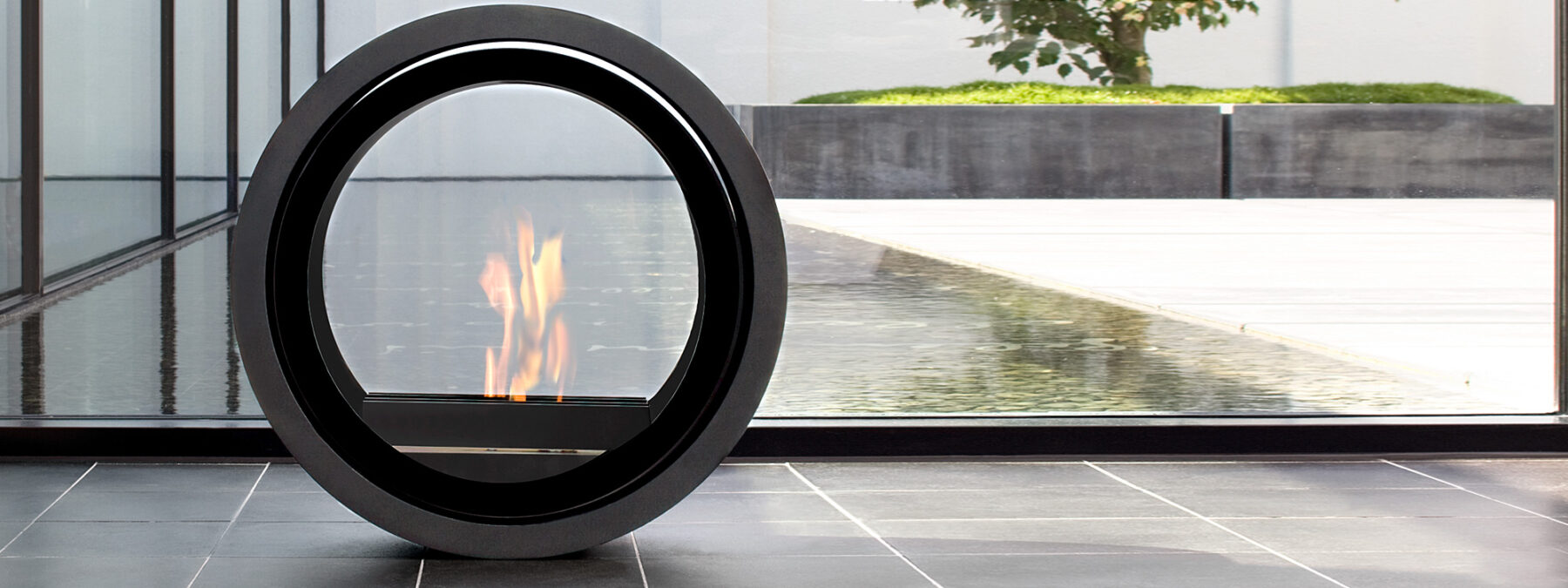 Image of ROLL Circular Ethanol Fire, A Modern Flueless Fire By Sieger Design. Roll Contemporary Bio Ethanol Fire Is Made In Luxury Alcohol Fireplace Materials And Is Manufactured By CONMOTO Modern Fireside Accessories Company, Germany.