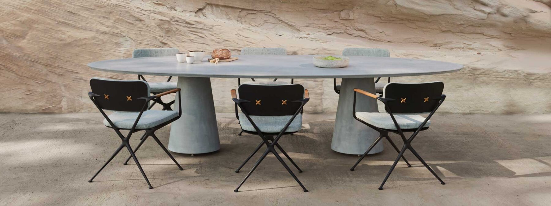 Image of Conix modern elliptical garden table and Exes garden chairs by Royal Botania