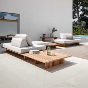 Image of Deck teak garden corner sofa with light-grey cushions on sunny terrace