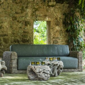 Image of Gommaire Doran all-weather wicker garden sofa & Root Ball teak side tables in a shady garden room