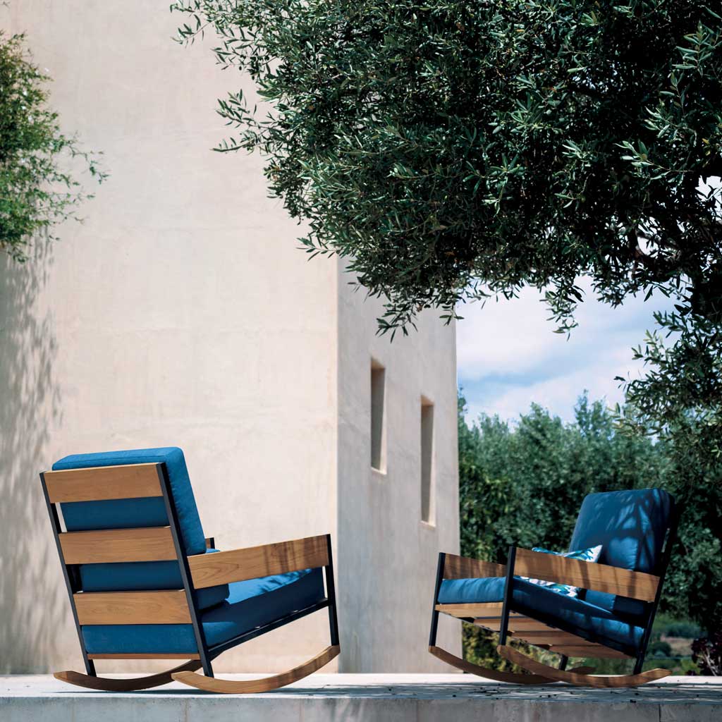 Image of pair of Nap garden rocking chairs on poured concrete terrace