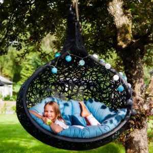 Image of Girl relaxing in Bios Nest garden egg chair