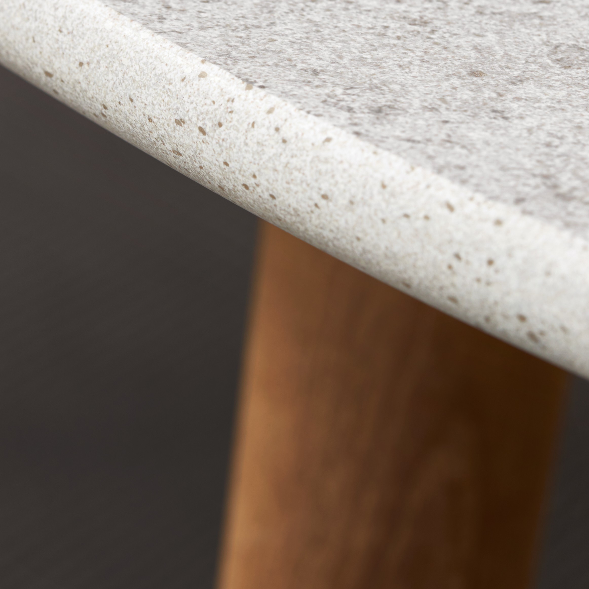Macro shot of Royal Botania Styletto table with teak legs and ceramic table top